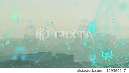 Projecting turquoise network overlay linking icons over hazy harbor cranes and rooftops, copy space Projecting turquoise network overlay linking icons over hazy harbor cranes and rooftops, copy space 129569247