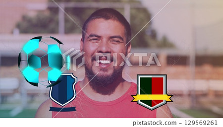 Image of neon soccer ball over team symbols and happy caucasian man 129569261