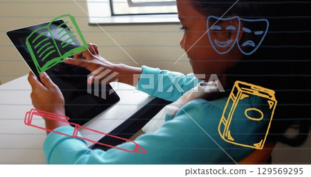 Image of school items icons over african american schoolgirl using tablet Image of school items icons over african american schoolgirl using tablet 129569295
