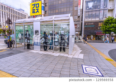 Tokyo cityscape in Japan, including a smoking area in front of Kinshicho Station 129569358