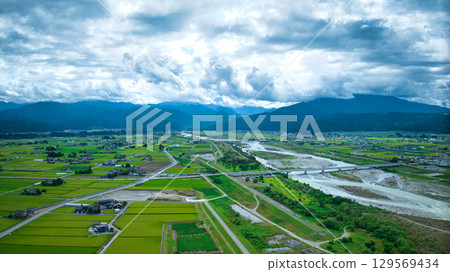 The Kurobe River in the Kurobe River alluvial fan, the Hokuriku Shinkansen viaduct, the Hokuriku Expressway, and other roads in summer 129569434