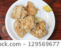 Fried chicken on a white plate 129569677