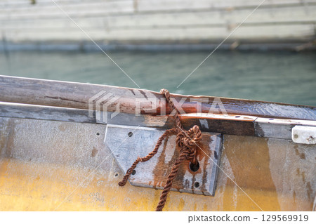 Wooden paddle board on the boat 129569919