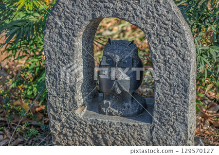 Stone owl sculpture framed by a rock archway in Kawagoe Saitama Japan Stone owl sculpture framed by a rock archway in Kawagoe Saitama Japan 129570127
