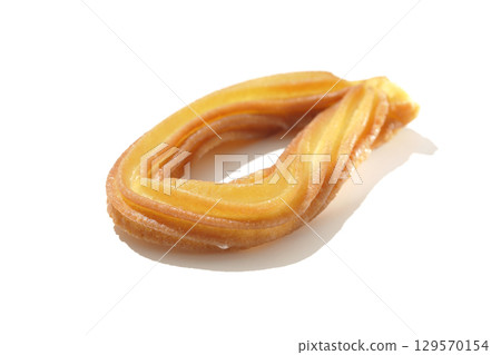 Churros photographed on a white background 129570154