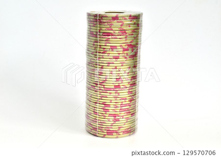 A stack of metal glass jar lids. 129570706