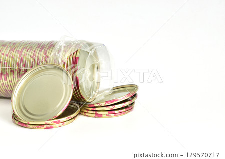 A stack of metal glass jar lids. A stack of metal glass jar lids. 129570717