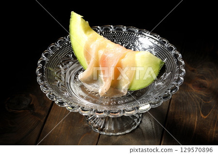 Raw ham melon 129570896