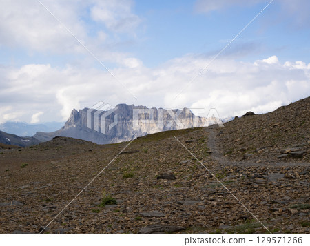 Col de Genevrier, France - September 2nd 2024: View along the valley towards Tete a l'Ane peak. 129571266