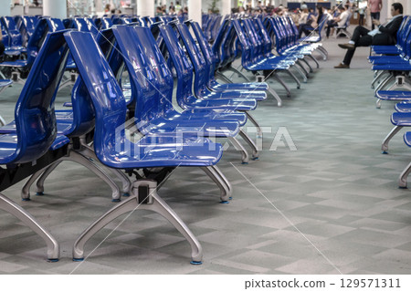 Blue waiting chairs in airport 129571311