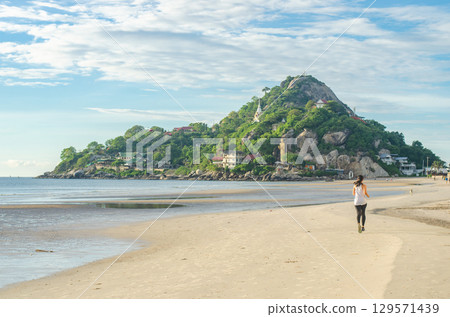 woman running on Tropical beach in morning at Huahin, Thailand, Wat Khao Takiap 129571439