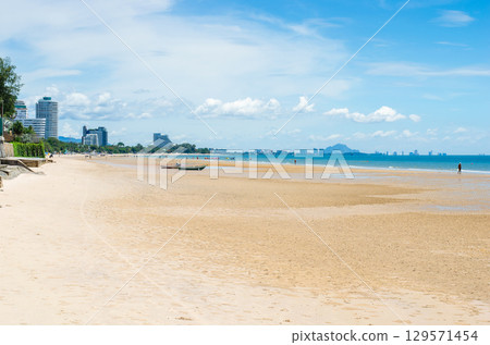 Seaside view with sandy beach and blue sky. Seaside view with sandy beach and blue sky. 129571454