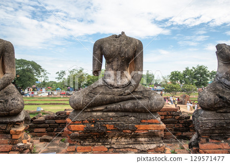 Wat Chaiwatthanaram temple, Ayutthaya historical park, Ayutthaya, Thailand Ancient Buddha statues in historical site 129571477