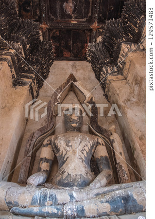 Wat Chaiwatthanaram temple, Ayutthaya historical park, Ayutthaya, Thailand Ancient Buddha statue in detailed cave setting Wat Chaiwatthanaram temple, Ayutthaya historical park, Ayutthaya, Thailand Ancient Buddha statue in detailed cave setting 129571483