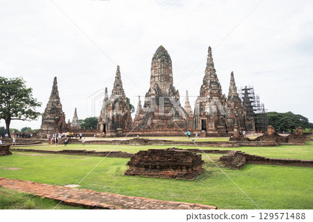 Wat Chaiwatthanaram temple, Ayutthaya historical park, Ayutthaya, Thailand Historic temple ruins in lush green landscape Wat Chaiwatthanaram temple, Ayutthaya historical park, Ayutthaya, Thailand Historic temple ruins in lush green landscape 129571488