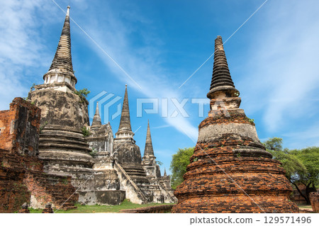 Wat Phra Si Sanphet, Ayutthaya historical park, Ayutthaya, Thailand Historic Buddhist temple with pagodas and blue sky 129571496