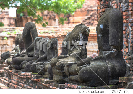 Wat Maha That, Ayutthaya, Thailand Ancient Buddha statues in a historic ruin Wat Maha That, Ayutthaya, Thailand Ancient Buddha statues in a historic ruin 129571503