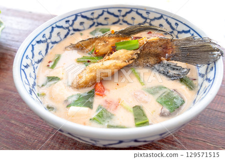 Thai spicy soup with fish and herbs Thai spicy soup with fish and herbs 129571515