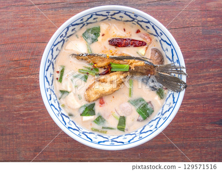 Thai spicy soup with fish and herbs Thai spicy soup with fish and herbs 129571516