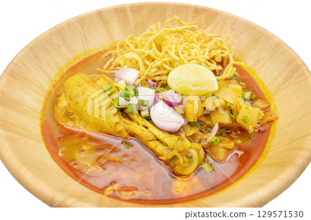KhaoSoi, Curry Noddle Soup with chicken, Thai traditional food, Northern style isolated on white background 129571530