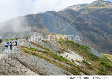 Happo Alpen Line Nature trail, Hakuba, Nagano, Japan, Hikers on rocky mountain trail 129571659