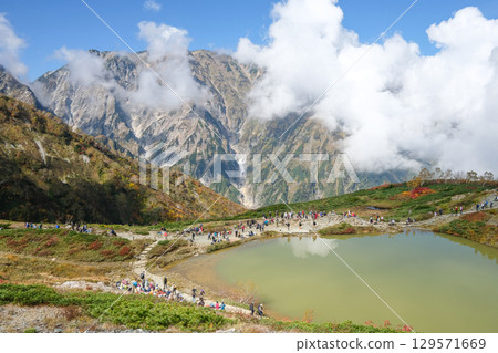 Happo pond, Happo Alpen Line Nature trail, Hakuba, Nagano, Japan, Scenic mountain landscape with a tranquil lake 129571669