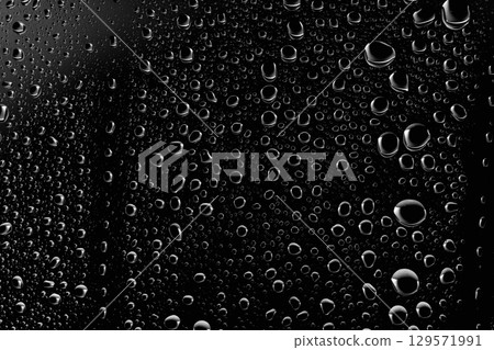 Water droplets on the surface of glass. Water droplets on the surface of glass. 129571991