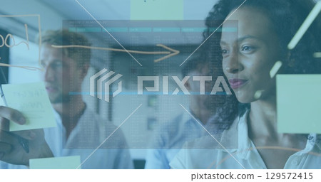 Image of data processing against african american woman sticking memo notes at office Image of data processing against african american woman sticking memo notes at office 129572415
