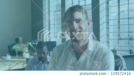 Image of data processing against portrait of caucasian man smiling at office Image of data processing against portrait of caucasian man smiling at office 129572416