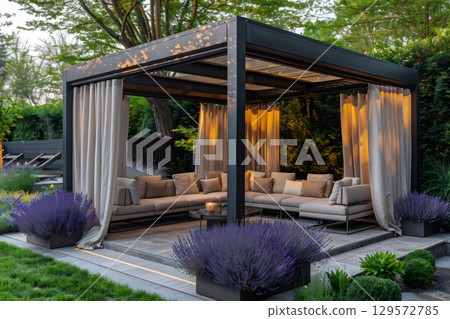 Modern Outdoor Lounge with Cozy Seating and Drapes Modern Outdoor Lounge with Cozy Seating and Drapes 129572785