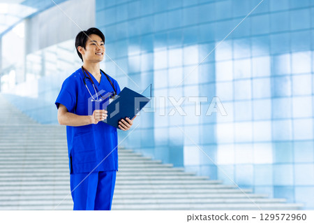 Young doctor working in a hospital 129572960