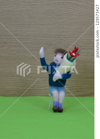 A boy with a bouquet A boy with a bouquet 129573427