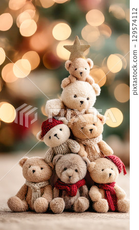 Adorable teddy bears arranged in a festive Christmas tree shape, adorned with a golden star, creating a warm holiday atmosphere 129574112