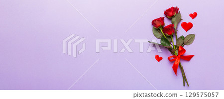 Valentine day composition with rose flower and red heart on table. Top view, flat lay, copy space Holiday concept 129575057