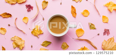 Cup of cocoa with autumn leaves abstract still life top view vith copy space 129575210