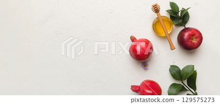 Flat lay composition with symbols jewish Rosh Hashanah holiday attributes on colored background, Rosh hashanah concept. New Year holiday Traditional. Top view with copy space 129575273