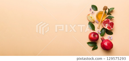 Flat lay composition with symbols jewish Rosh Hashanah holiday attributes on colored background, Rosh hashanah concept. New Year holiday Traditional. Top view with copy space Flat lay composition with symbols jewish Rosh Hashanah holiday attributes on colored background, Rosh hashanah concept. New Year holiday Traditional. Top view with copy space 129575293