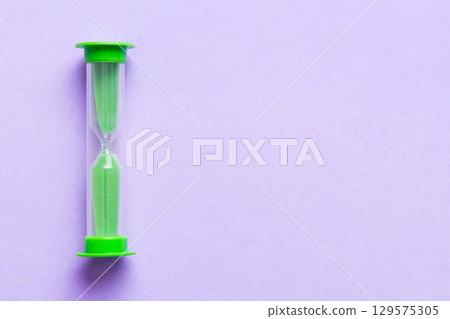 hourglass on the table, sand clock as time passing concept for business deadline, copy space hourglass on the table, sand clock as time passing concept for business deadline, copy space 129575305