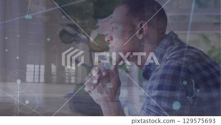 Image of connected dots over multiracial man doing pushup and thoughtful man at home 129575693
