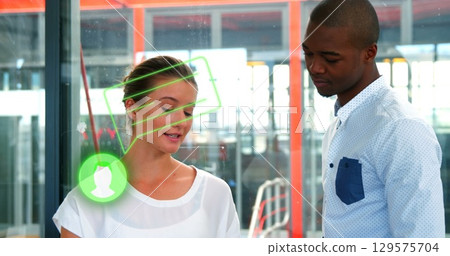 Image of person icon and speech bubble over diverse male and female colleague talking in office 129575704