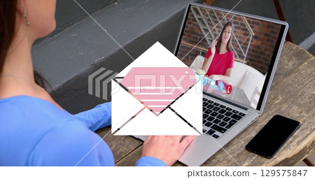 Image of email icon over caucasian woman on laptop image call Image of email icon over caucasian woman on laptop image call 129575847