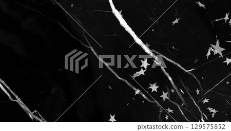 Image of white lightning bolts with falling white stars in on black background 129575852