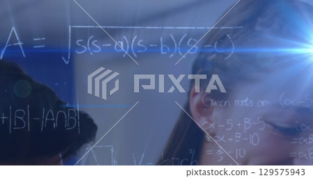 Image of light trails and mathematical equations over caucasian schoolgirl 129575943