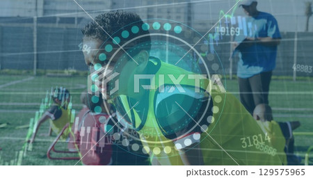 Image of scope scanning and data processing over boy football player on pitch Image of scope scanning and data processing over boy football player on pitch 129575965