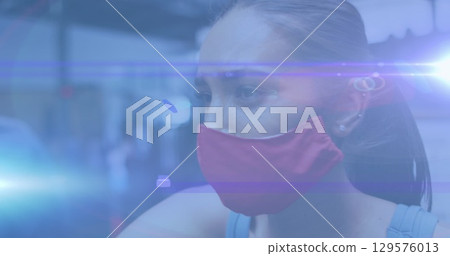 Image of network of connections over woman wearing vr headset 129576013