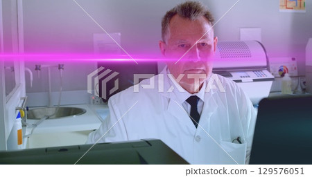 Image of light spots over caucasian male doctor in lab Image of light spots over caucasian male doctor in lab 129576051