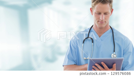 Image of caucasian male doctor over hospital 129576086