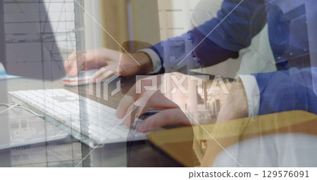 Image of hands using computer over diverse business people in office Image of hands using computer over diverse business people in office 129576091