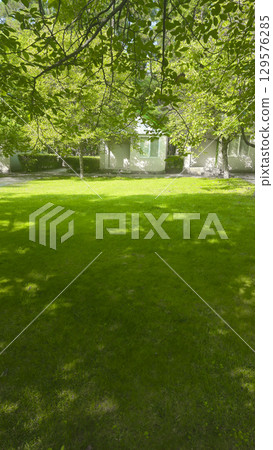 Plot with decorative grass and white houses for recreation. Tourist recreation. 129576285