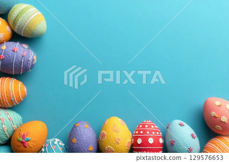 Decorated Easter eggs and space for text on color background, top view Decorated Easter eggs and space for text on color background, top view 129576653